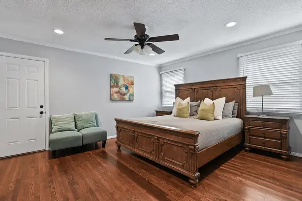 Primary bedroom with king bed and seating area